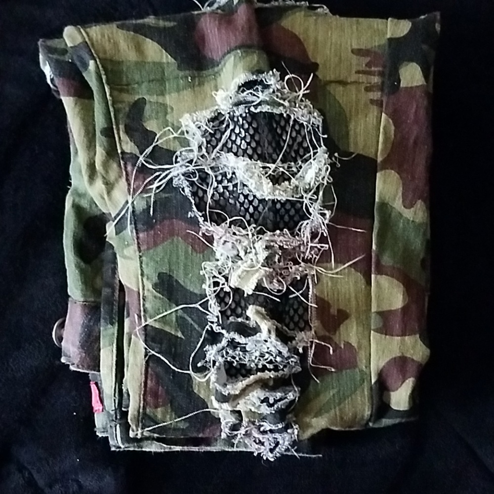 Destroyed camo pants with sewn in fishnet mesh